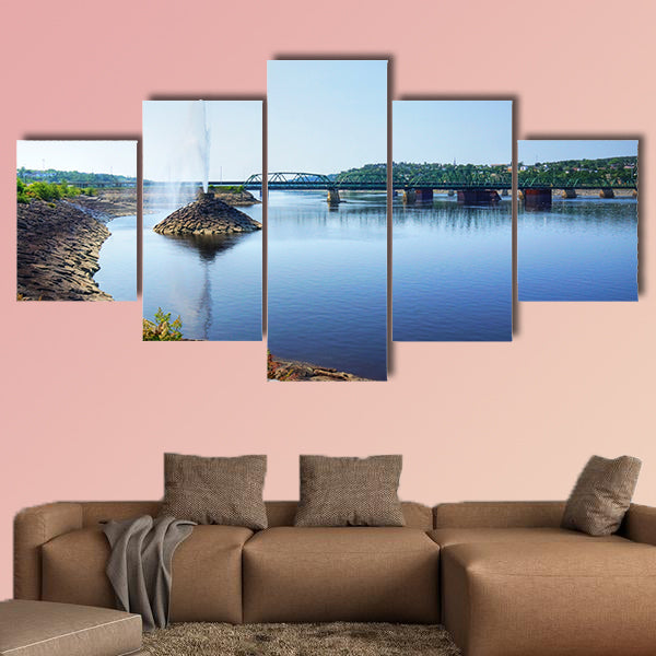 Beautiful water fountain in a river by a bridge, public park wall art