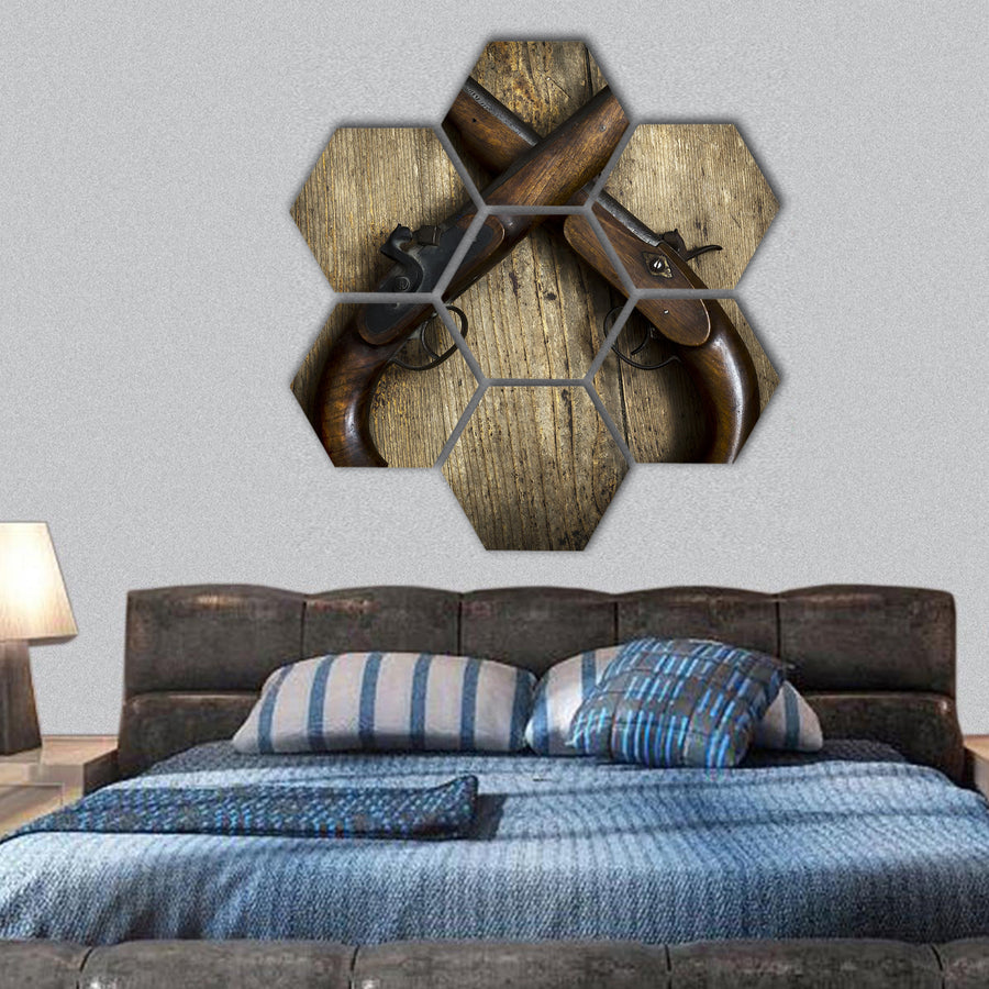 Two vintage pistols on wooden background hexagonal canvas wall art