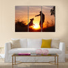 Creative man with his yellow labrador retriever in nature - back lit Multi panel canvas wall art