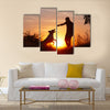 Creative man with his yellow labrador retriever in nature - back lit Multi panel canvas wall art