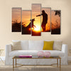 Creative man with his yellow labrador retriever in nature - back lit Multi panel canvas wall art