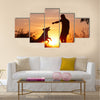 Creative man with his yellow labrador retriever in nature - back lit Multi panel canvas wall art