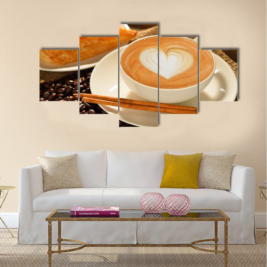 A cup of cafe latte with coffee beans and puff pastry Multi Panel Canvas Wall Art
