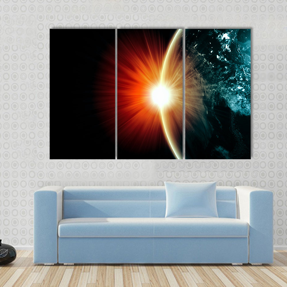 Planet Earth with appearing sunbeam light Multi Panel Canvas Wall Art