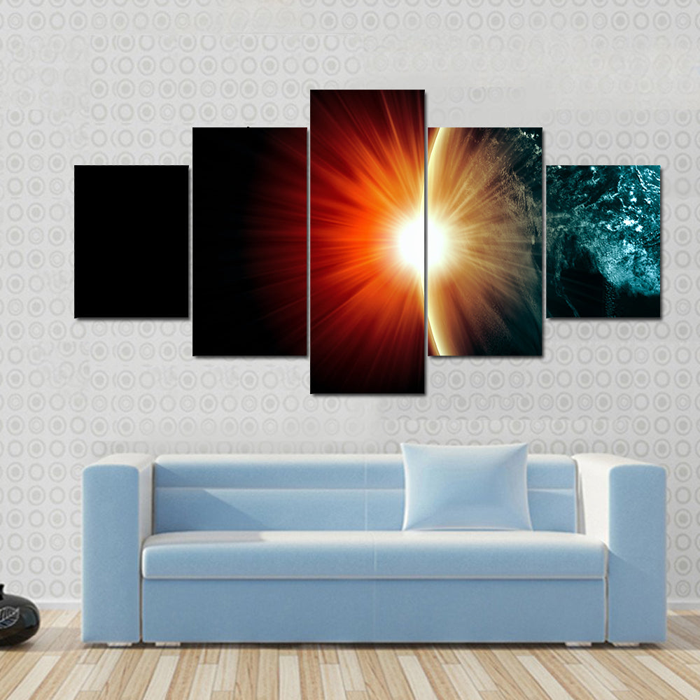 Planet Earth with appearing sunbeam light Multi Panel Canvas Wall Art