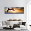 Couple jumping dolphins, beautiful sea sunset panoramic canvas wall art