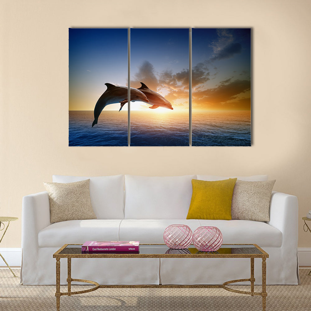 Couple jumping dolphins, beautiful sea sunset Multi Panel Canvas Wall Art