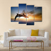 Couple jumping dolphins, beautiful sea sunset Multi Panel Canvas Wall Art