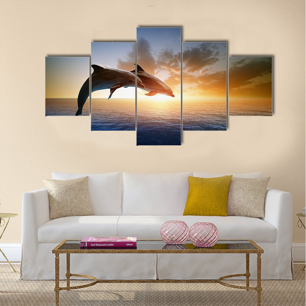 Couple jumping dolphins, beautiful sea sunset Multi Panel Canvas Wall Art