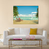 Frontal view of a caribbean beach with deck chairs and boat Multi panel canvas wall art