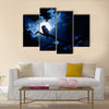 This is a photo of quiet night, bright moon, and Barred Owl sits motionless in the blue moonlight Multi panel canvas wall art