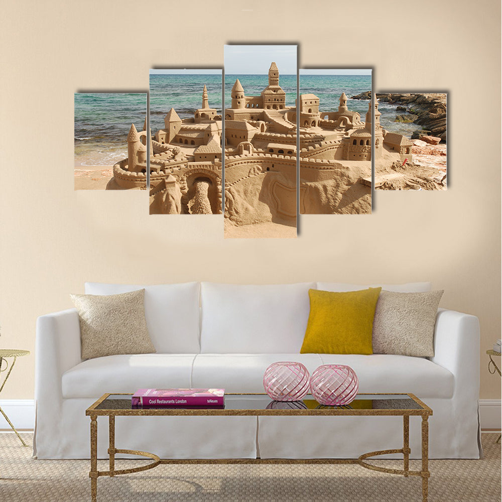 Amazing sandcastle on a mediterranean beach Multi Panel Canvas Wall Art