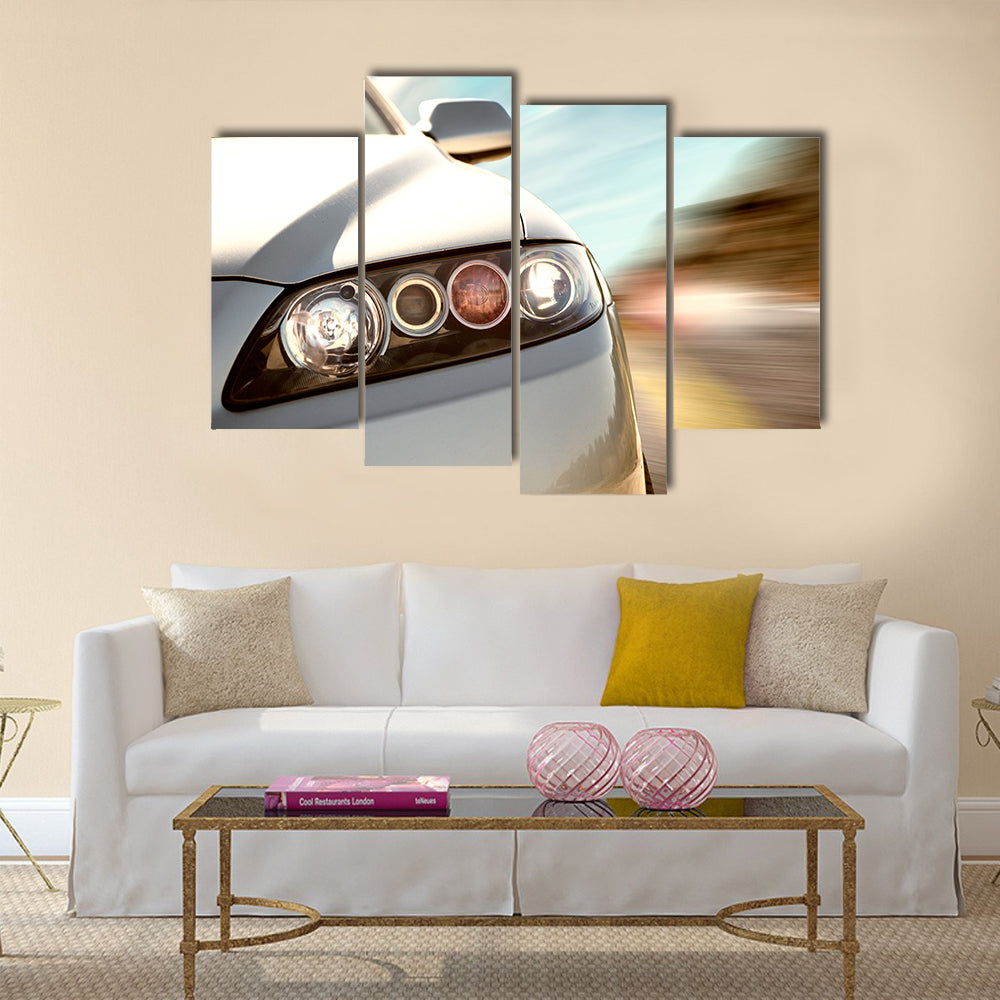A car driving on a motorway at high speeds, overtaking other cars Multi panel canvas wall art