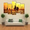 Silhouettes Of The Traditional Fishermen At The Sunset Near Galle In Sri Lanka Multi Panel Canvas Wall Art