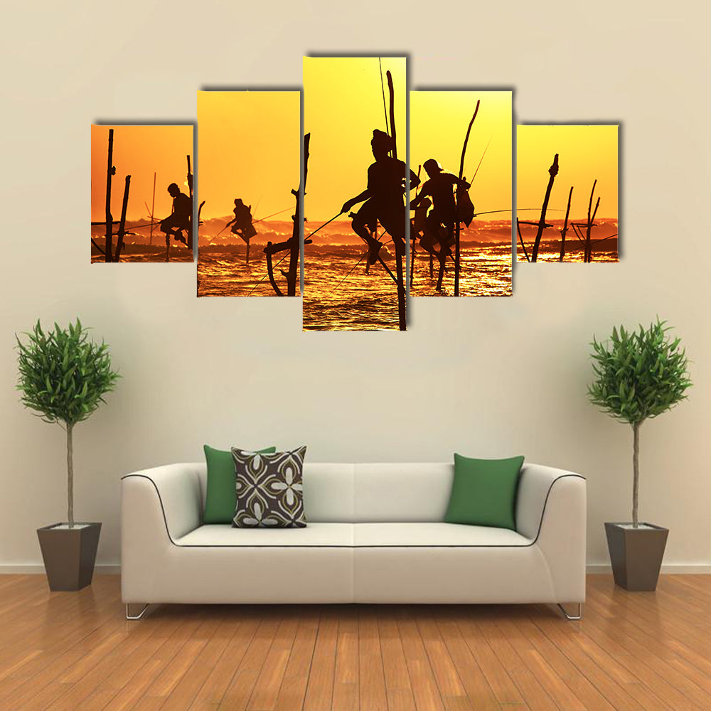 Silhouettes Of The Traditional Fishermen At The Sunset Near Galle In Sri Lanka Multi Panel Canvas Wall Art