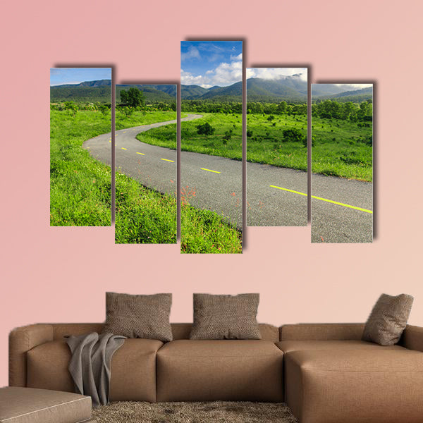 Beautiful countryside road under blue sky multi panel canvas wall art