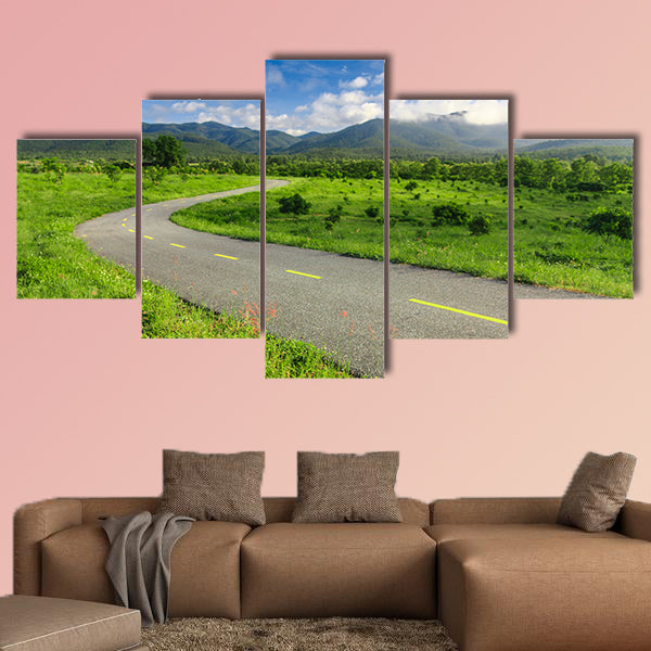Beautiful countryside road under blue sky multi panel canvas wall art