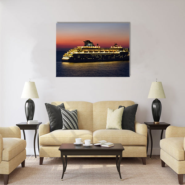 Big cruise ship with lights open at sunset Multi Panel Canvas Wall Art