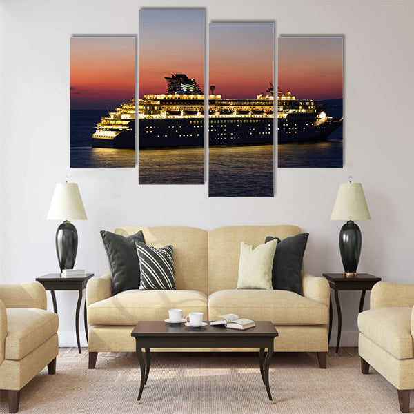 Big cruise ship with lights open at sunset Multi Panel Canvas Wall Art