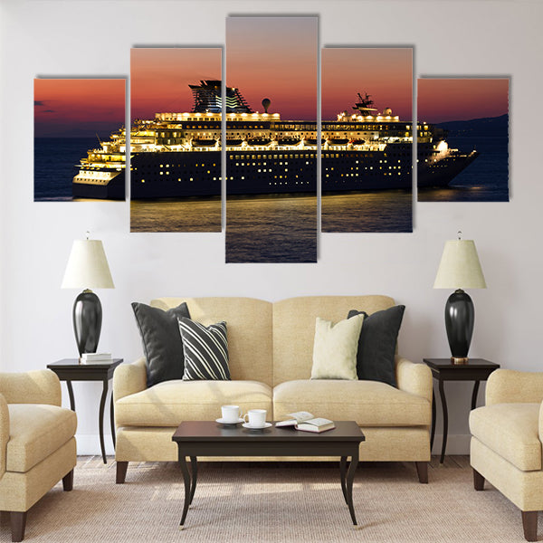 Big cruise ship with lights open at sunset Multi Panel Canvas Wall Art