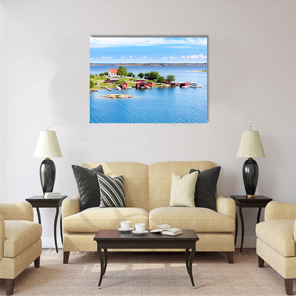 Small village with red buildings in Finnish archipelago Multi panel canvas wall art
