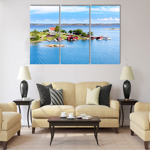 Small village with red buildings in Finnish archipelago Multi panel canvas wall art