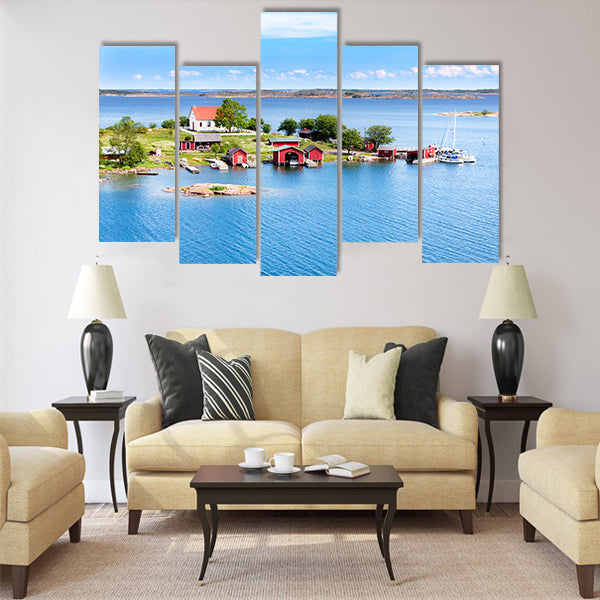 Small village with red buildings in Finnish archipelago Multi panel canvas wall art