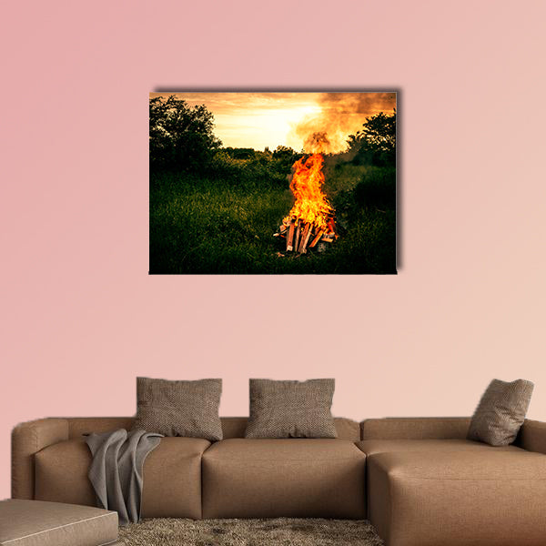 Bonfire at a camp in natural surroundings multi panel canvas wall art