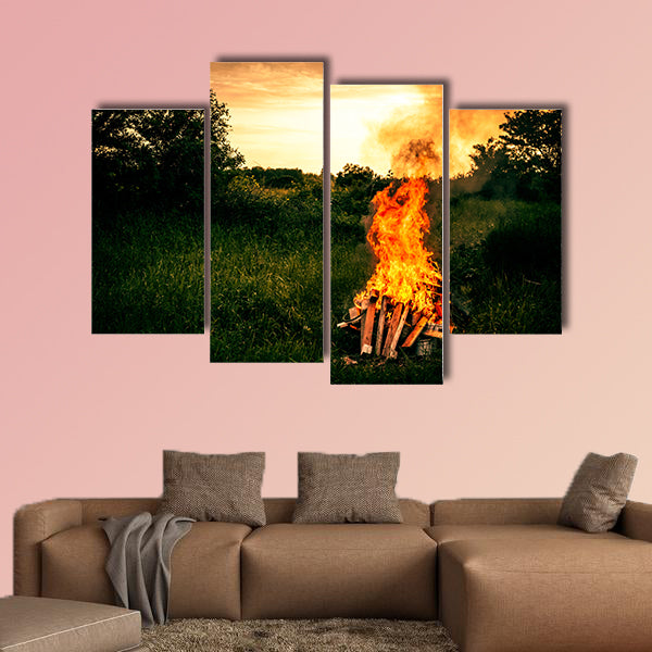 Bonfire at a camp in natural surroundings multi panel canvas wall art