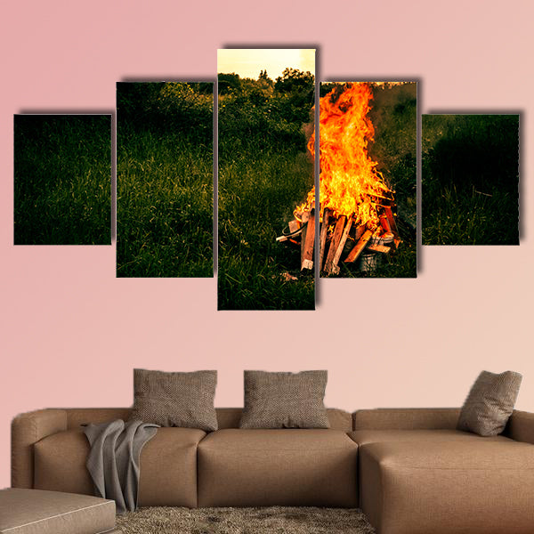 Bonfire at a camp in natural surroundings multi panel canvas wall art