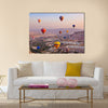 Hot air balloon flying over rock landscape at Cappadocia Turkey, multi panel canvas wall art