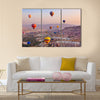 Hot air balloon flying over rock landscape at Cappadocia Turkey, multi panel canvas wall art