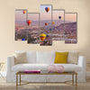 Hot air balloon flying over rock landscape at Cappadocia Turkey, multi panel canvas wall art