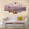 Hot air balloon flying over rock landscape at Cappadocia Turkey, multi panel canvas wall art