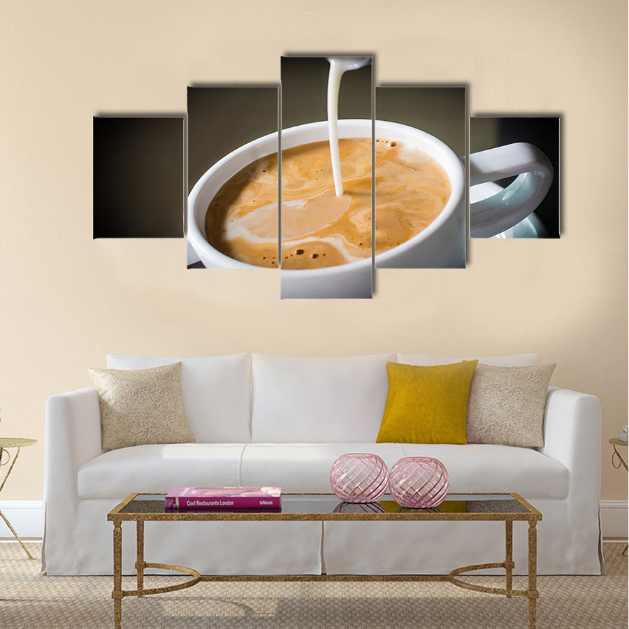 Pouring cream into a cup of coffee Multi Panel Canvas Wall Art