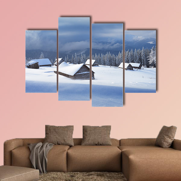 Winter landscape with wooden houses in a mountain valley multi panel canvas wall art