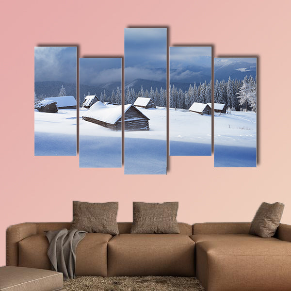 Winter landscape with wooden houses in a mountain valley multi panel canvas wall art