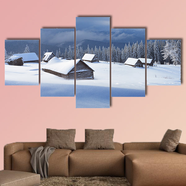 Winter landscape with wooden houses in a mountain valley multi panel canvas wall art