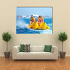 Happy People having Fun on Banana boat Multi Canvas Print Wall Art