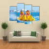 Happy People having Fun on Banana boat Multi Canvas Print Wall Art