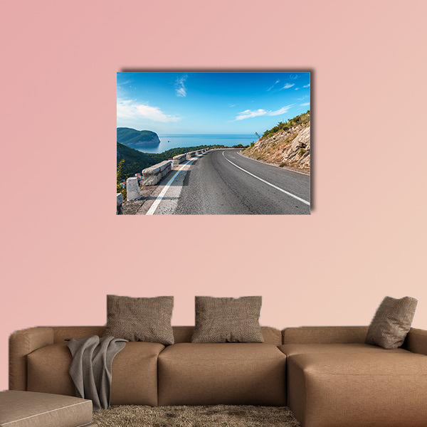 Turning mountain highway with blue sky and sea on a background wall art