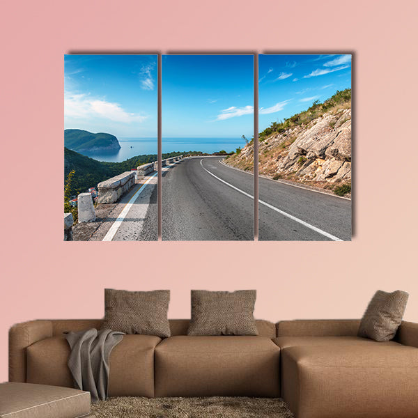 Turning mountain highway with blue sky and sea on a background wall art