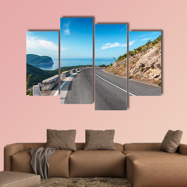 Turning mountain highway with blue sky and sea on a background wall art