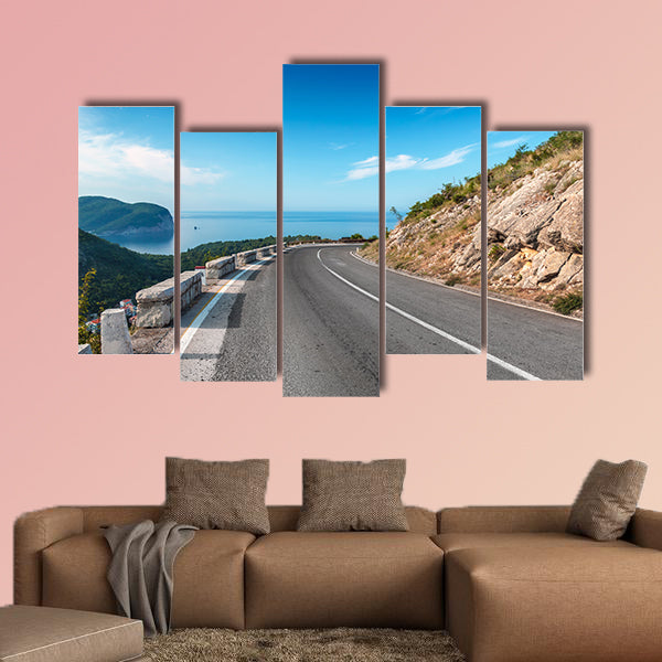 Turning mountain highway with blue sky and sea on a background wall art