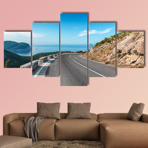 Turning mountain highway with blue sky and sea on a background wall art