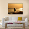 A young woman taking a walk on the beach at sunset on Sanibel Island – enhanced and added birds, Multi panel canvas wall art