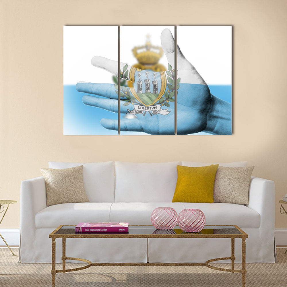 Cheering fan with painting national San Marino flag with your hand for cheer your national sport Multi panel canvas wall art