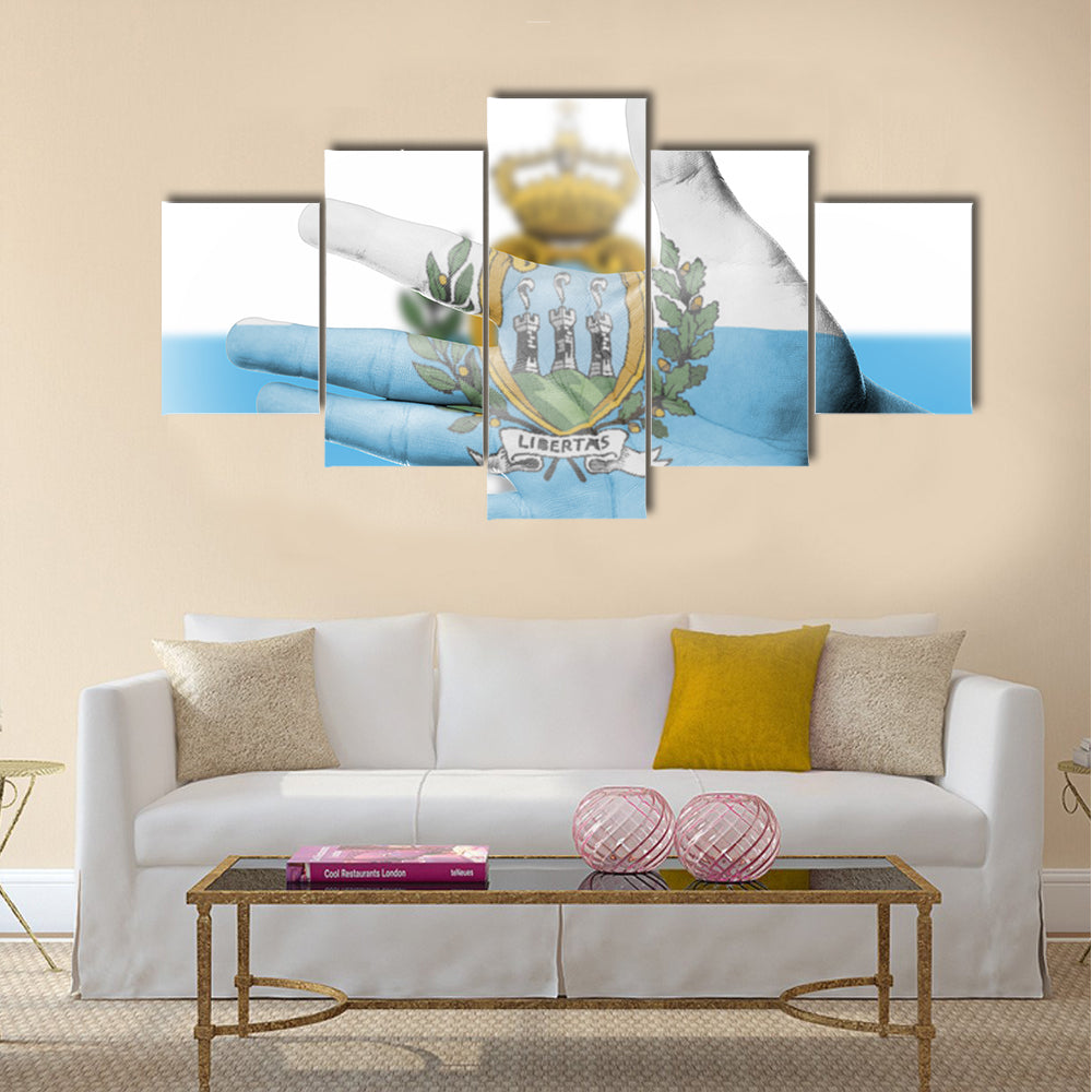 Cheering fan with painting national San Marino flag with your hand for cheer your national sport Multi panel canvas wall art