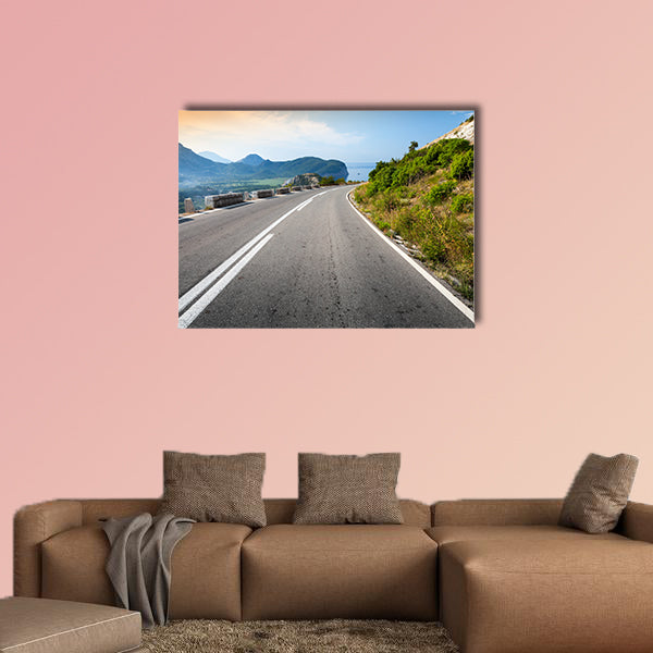 Turning mountain highway with sky and sea on a background wall art