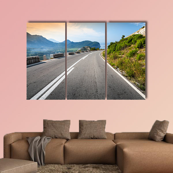 Turning mountain highway with sky and sea on a background wall art
